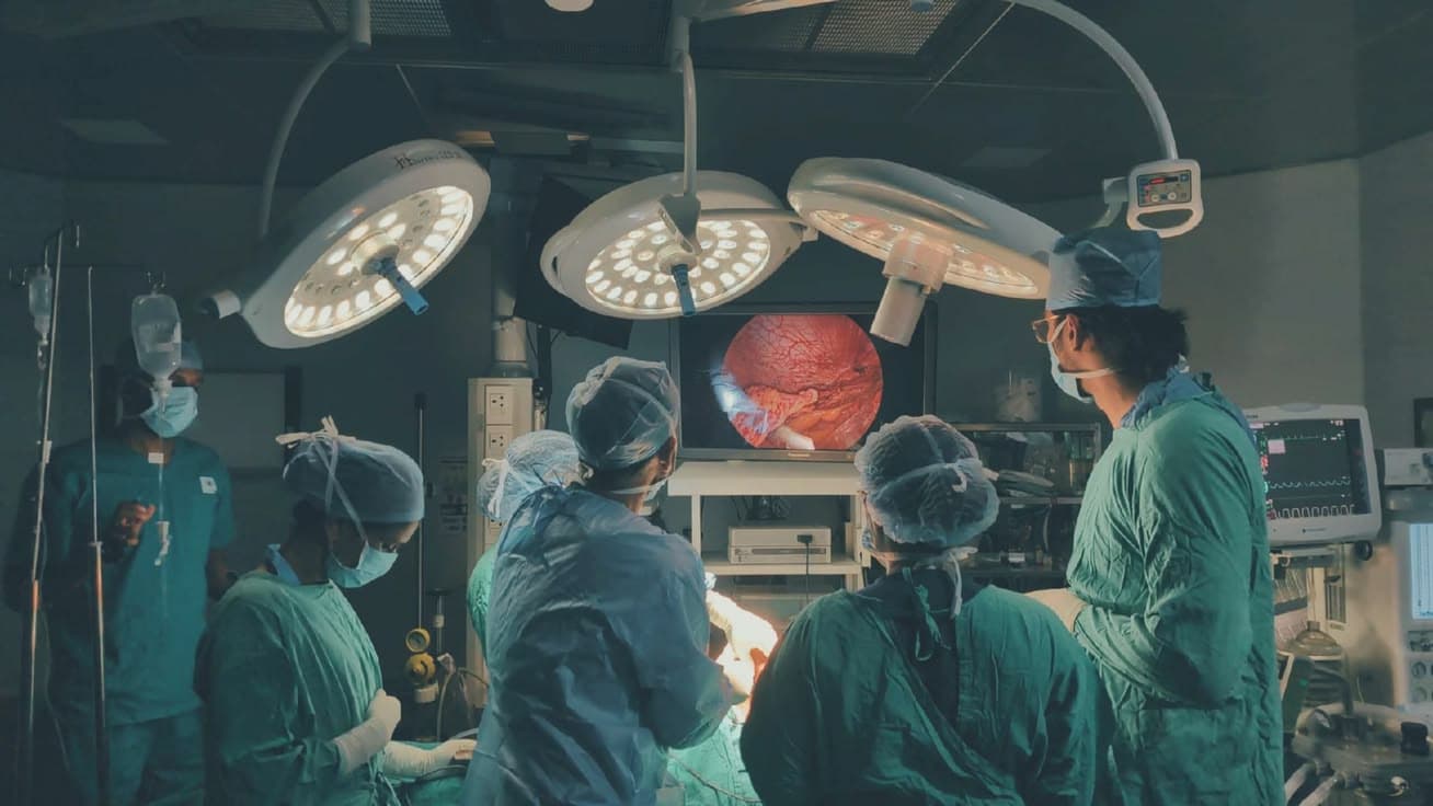 Medical team working together in an operating room